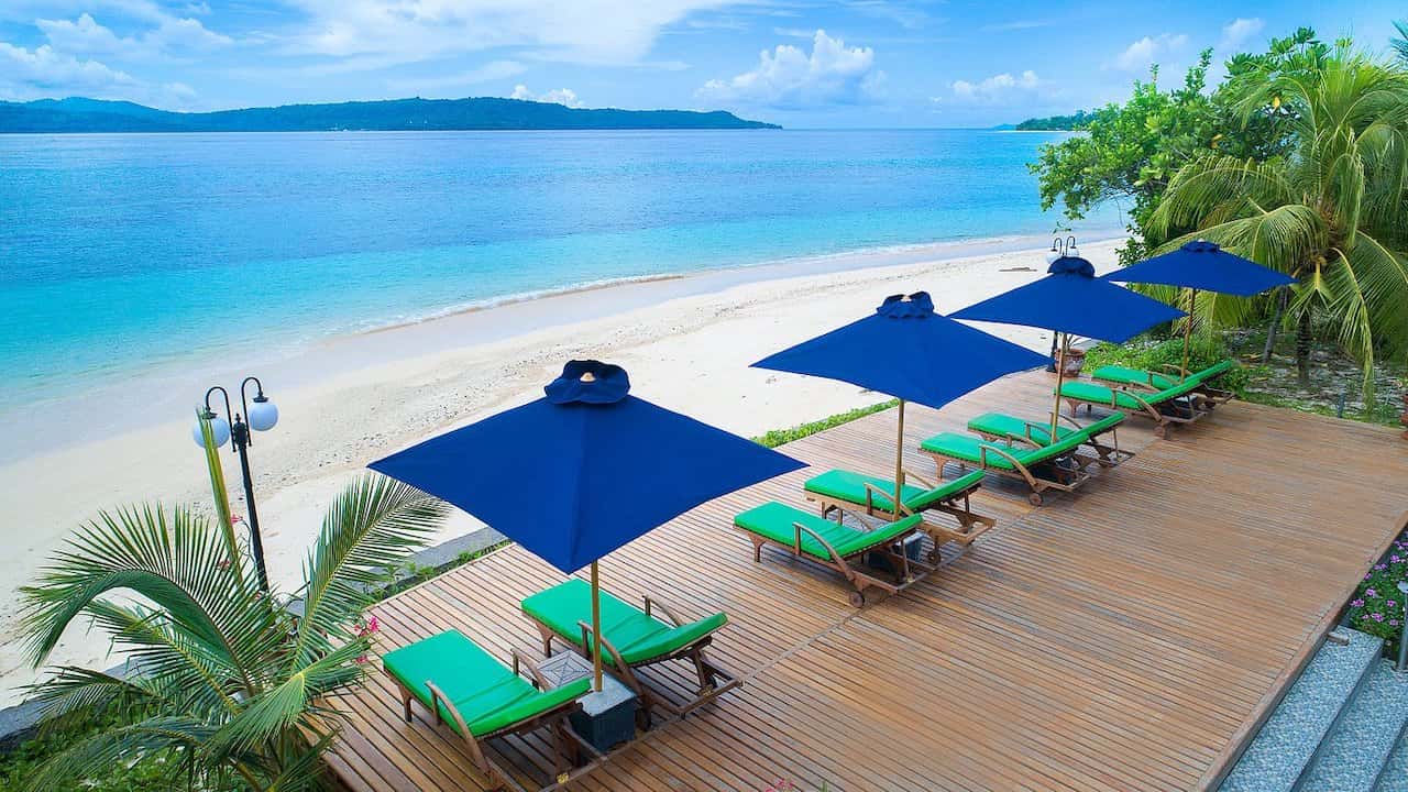 Beach and sun deck at Gangga Island Resort & Spa, North Sulawesi