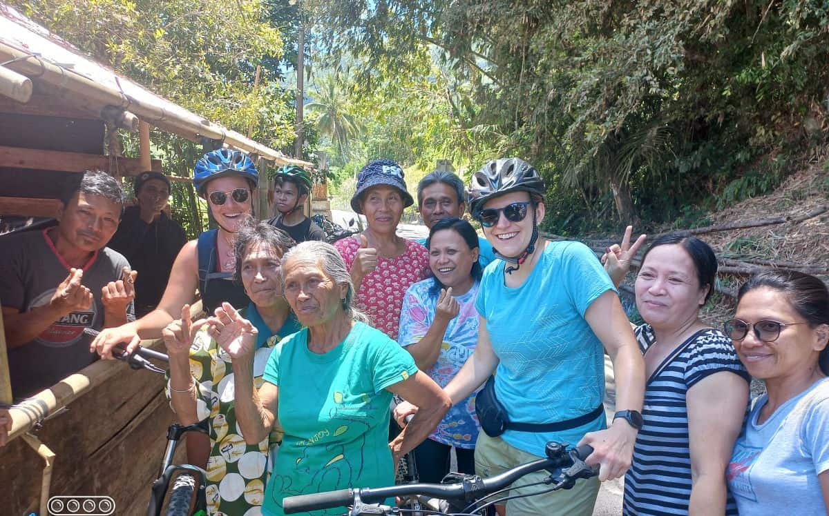 Exploring Tondano by bike and interacting with local people